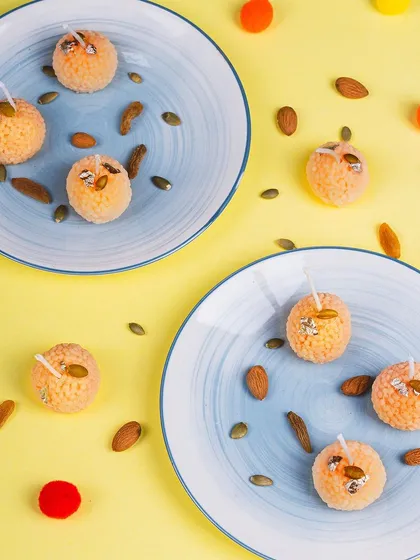 My ladoo candles are always a bestseller during the festive season. I hand-roll each one and add details like silver leaf to make them look incredibly realistic. They are a sweet, fragrant way to light up your celebrations.