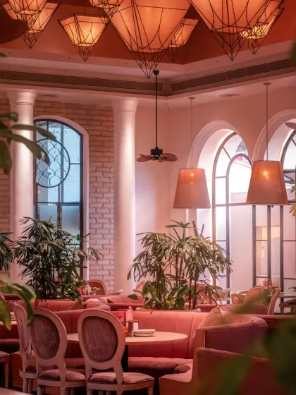 The rich, moody decor of my mansion, with its plush pink booths and dramatic lighting, sets the stage for a dining experience that is both luxurious and full of character.