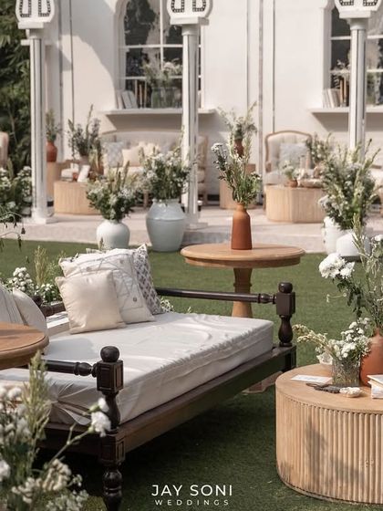 A close-up of a traditional Indian daybed used as part of the lounge seating, adding a unique cultural element to the modern design.