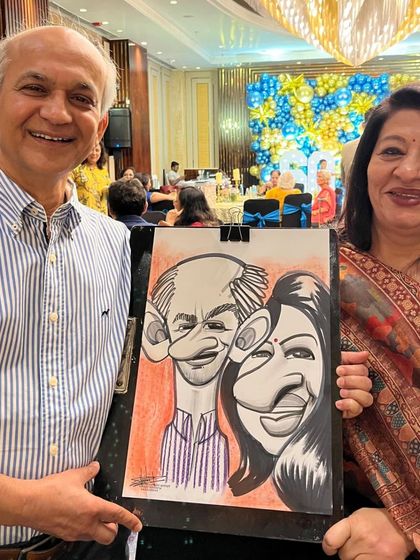 A happy couple with their colorful caricature. The red and purple background adds a lot of energy.