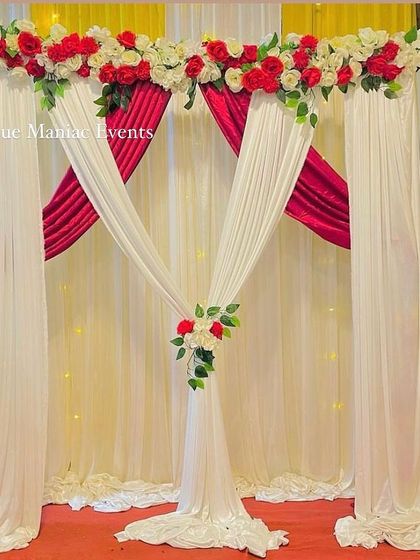 A simple yet striking backdrop with red and white drapes and a floral border. This versatile design can be used for birthdays, anniversaries, or other small events.