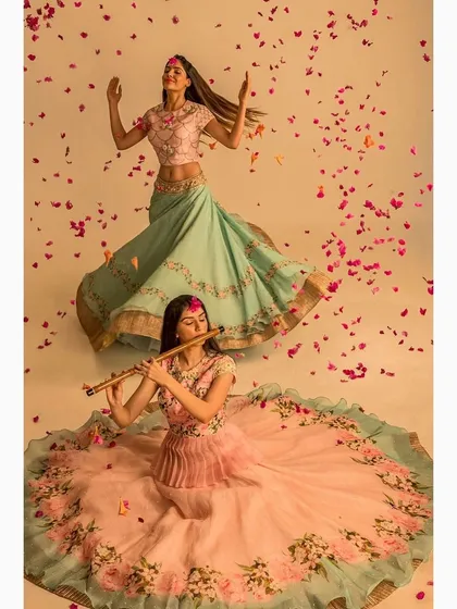 A creative fashion shoot for an ethnic wear designer, using props like a flute and falling petals to build a poetic and dreamlike mood. This image demonstrates my conceptual approach to making garments part of a larger visual narrative.