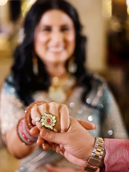 A detail shot focusing on the beautiful and unique engagement ring, a symbol of the couple's promise to each other.