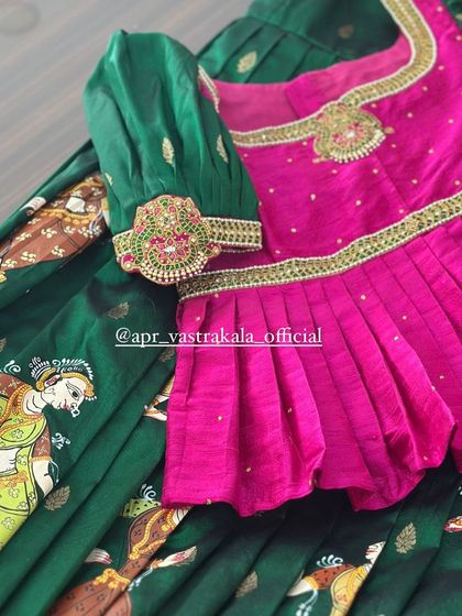 The combination of a hand-painted skirt and an embroidered blouse makes this a truly special occasion outfit for any child.