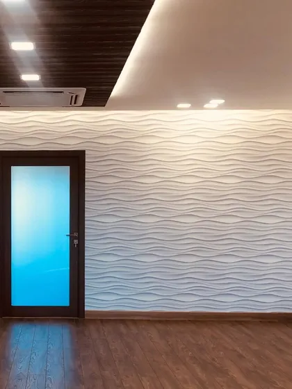 A shot of the 3D wave wall before the furniture was moved in. This textured feature wall is a great way to add interest and a sense of movement to a room.