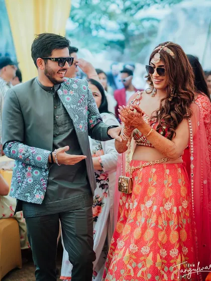 A candid moment of the couple, the bride's hair looking perfect.