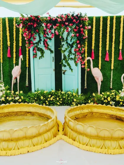 A detailed shot of the Haldi seating, a perfect blend of traditional elements and quirky, modern props.