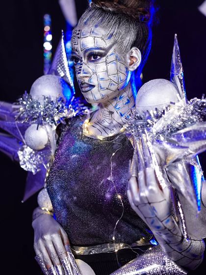 A close-up of the robotic makeup, showing the intricate details on the face and neck.