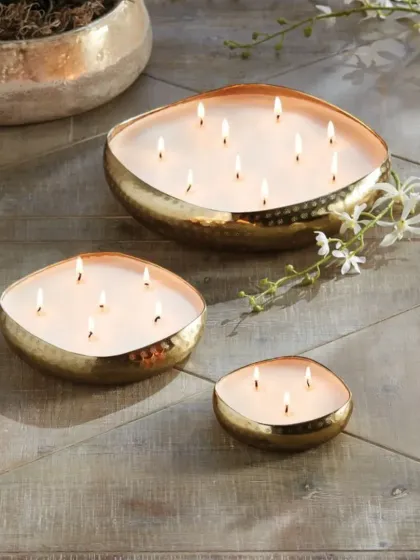 My multi-wick urli candles are available in various sizes, as shown here. They are perfect for creating a grand centerpiece and providing a beautiful, ambient glow for a large space.