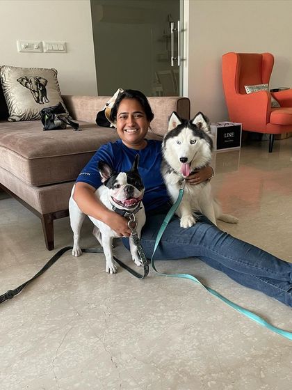 Getting up close with a client's French Bulldog and Husky. Building a personal connection with each dog is the first step to effective training. Understanding their individual temperaments helps me create a tailored plan.