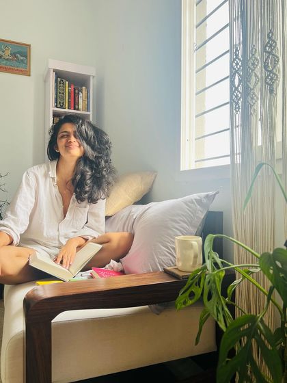 A quiet moment at home with a book. My reading nook is my sanctuary, where I recharge and find new ideas to pour into my own writing.