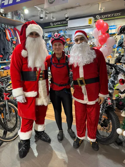 Even the bike shop gets in on the festive spirit! Our Santas posing with a member inside a partner store.