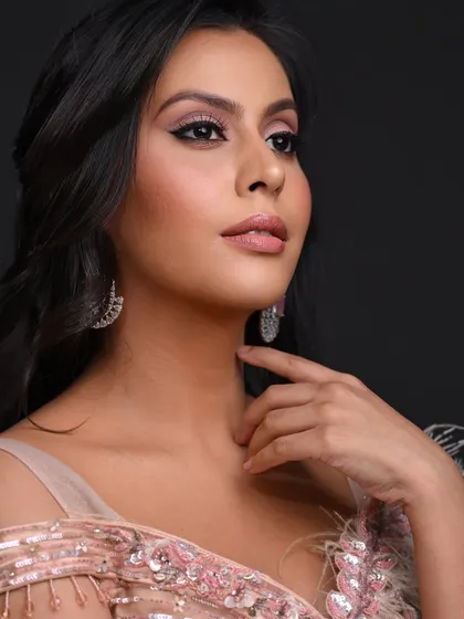 A close-up shot focusing on the clean, precise eyeliner and soft pink tones.