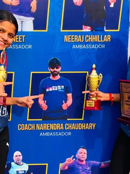 Two of my champion athletes posing with their trophies from the Run for Integrity. As their ambassador, it's a proud moment to see them succeed.