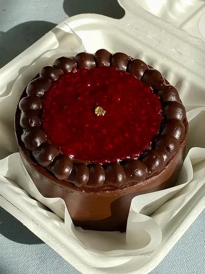 This Raspberry Dark Chocolate bento cake is a perfect balance of sweet and tart. It's filled with raspberry compote and rich dark chocolate, making for an indulgent mini dessert.