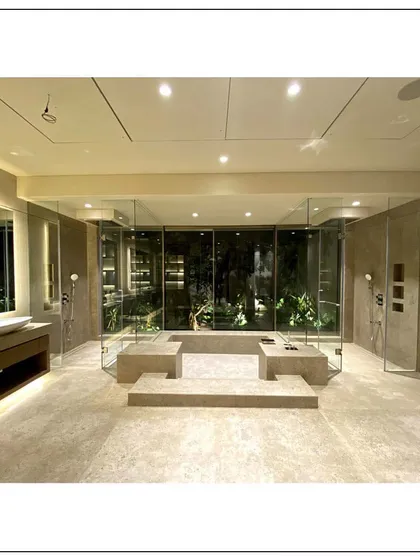 This bathroom in our Aamby Valley project is a perfect blend of indoor-outdoor living. We created a spa-like atmosphere with an open-air feel, a luxurious jacuzzi shower, and stunning natural views, all while maintaining complete privacy and comfort.