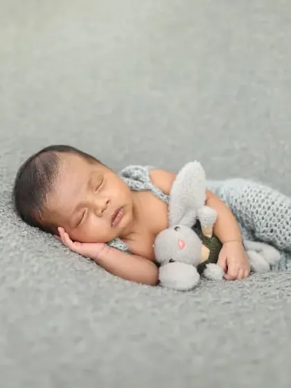 Sleeping soundly with a tiny bunny friend. I have lots of little stuffed animals that are perfect for newborn sessions, adding a touch of sweetness.