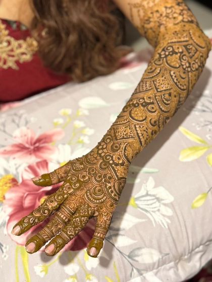 Another view of the same full-arm design, showcasing the intricate geometric and floral patterns.
