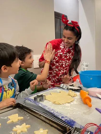 High-fives all around for a job well done. I love celebrating these small victories with the kids during our Christmas cookie baking class.