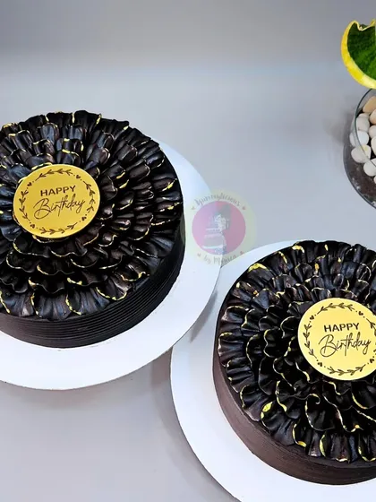 Two of our popular chocolate petal cakes, ready to go out for different celebrations.