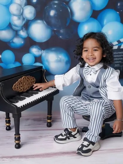 Every child has a unique personality, and my goal is to let it shine. This little musician was all smiles during his second birthday shoot, complete with a dapper suit and his own mini piano.