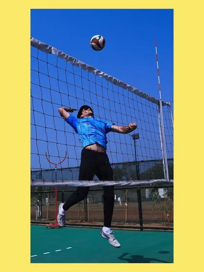 I demonstrate a spike, showing the players the full range of motion and power required.