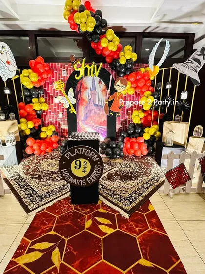 Welcome to Hogwarts. This detailed Harry Potter theme is a magical experience, featuring a Platform 9 3/4 entrance, house color balloons, and iconic elements like the Sorting Hat and Golden Snitch to transport guests to the wizarding world.