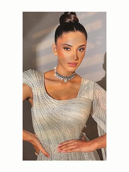 For a glamorous reception or engagement, I styled this shimmering, silver-toned gown. The sleek high bun and minimalist polki necklace complete a modern bridal look that is both elegant and party-ready.