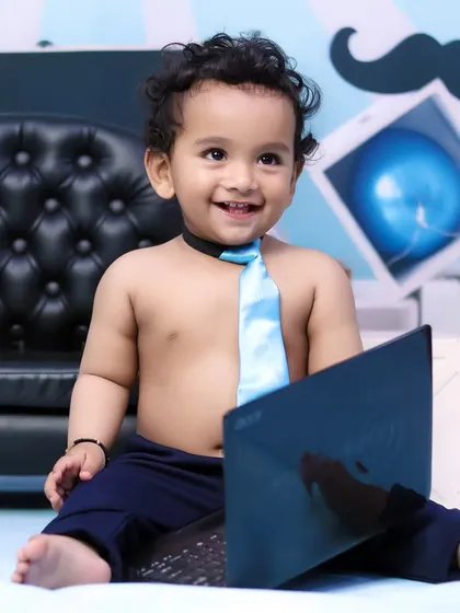 A close-up of our little boss, looking very pleased with his work. The details in our themed shoots make them special.