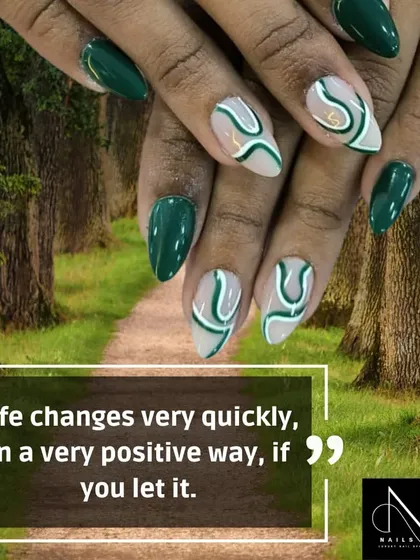 A nature-inspired design with abstract swirls. This set features a deep forest green polish with accent nails that have a sheer base and free-flowing green and white lines.