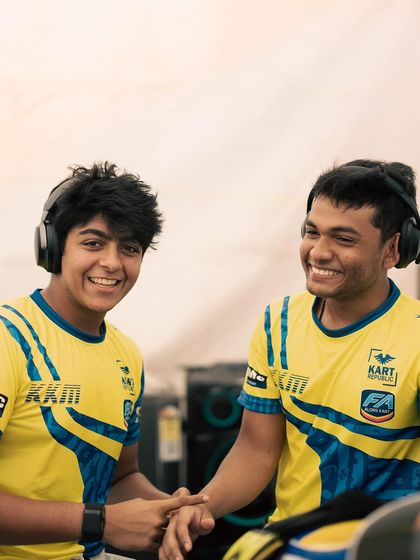 The smiles say it all. Teammates sharing a laugh in their team gear, a great example of the camaraderie we foster within the krew.