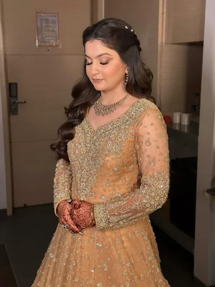 The complete look is one of understated luxury. The hair and makeup work together to enhance her features without masking them.