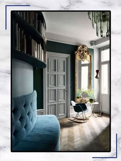 A spacious room with breathtaking hues and opulent furniture makes your home an ideal place to live. This design concept uses a bold mirror and a comfortable rocking chair to create a relaxing corner.