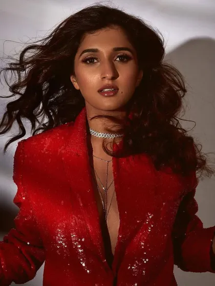 A celebrity look for Nidhhi Agerwal featuring a bold, sequined red blazer. I opted for a bronze smokey eye and a glossy nude lip to create a glamorous, red-carpet-ready look that feels both confident and sophisticated.