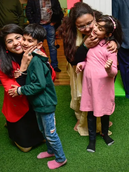 A cheek-to-cheek kind of day! A candid moment of hugs and affection between guests.