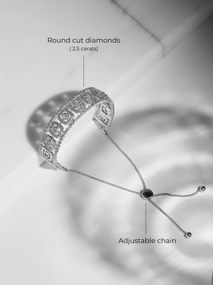 A product shot of the adjustable Diamond Kada, showing the intricate diamond setting and the practical adjustable chain mechanism.