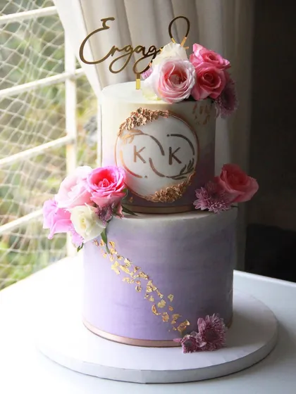 Another view of the lavender ombre engagement cake, showcasing the hand-painted custom monogram.