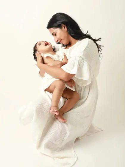 A mother and her youngest daughter share a laugh. Capturing these individual bonds within a family is so important.