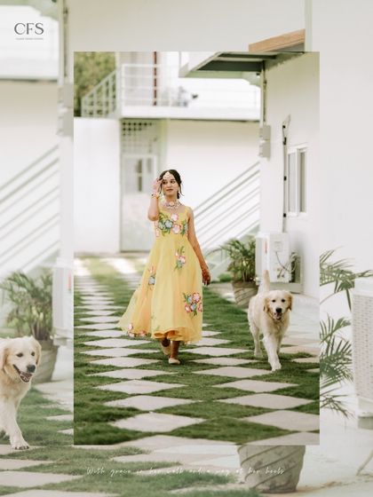 A bride's grand entrance with her furry friends. This heartwarming and unique shot from a Haldi ceremony shows that we are ready to capture all the special members of your family.
