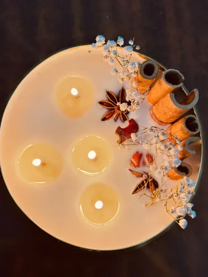 This 6-inch scented urli candle is a work of art. Topped with fragrant spices and dried flowers, it's an aesthetic decor piece for any home.