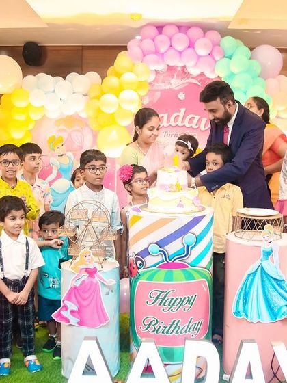 A vibrant 'Circus' themed birthday party, with red and white stripes, clown props, and colorful balloons, bringing the excitement of the big top to your event.