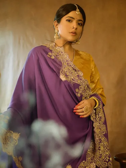 A beautiful, soft-focus shot of Sakshi Gopal. The makeup enhances her features while maintaining the vintage, film-like quality of the photoshoot.