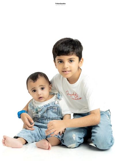 A simple and sweet studio portrait of two brothers. We focus on creating a comfortable space for children to be themselves, resulting in natural photos.