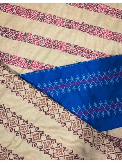 A beautiful flat lay of fabrics featuring Kasuti embroidery borders. These textiles are ready to be transformed into sarees, dupattas, or other custom apparel.