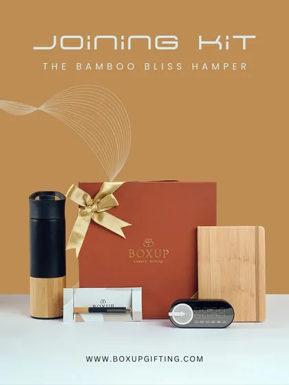 Introducing the Bamboo Bliss Hamper, a perfect employee joining kit for the eco-conscious workplace. This set includes a bamboo-finish tumbler, a bamboo notebook, and a digital clock, blending sustainability with modern functionality.