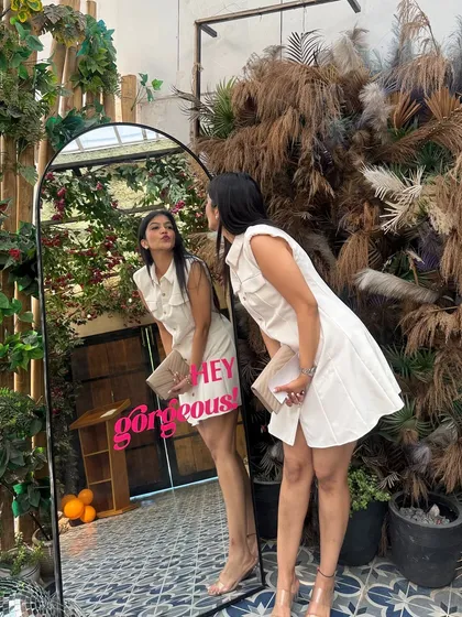 A fun mirror selfie in a chic white shirt dress. This is a versatile piece that's great for a brunch, a day event, or just a day you want to feel gorgeous.