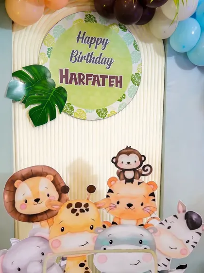 A close-up of the cute animal cutouts and "Happy Birthday" sign from the jungle safari theme.