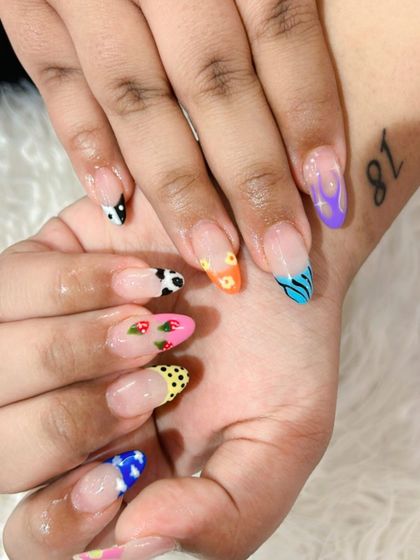 Can't decide on one design? Why not have them all. This fun set features a different design on every nail, including cow print, flames, flowers, and strawberries.