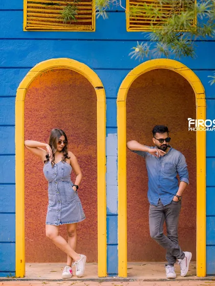 A stylish couple poses in our vibrant blue and yellow arched doorways, a popular spot for fun and modern photos.