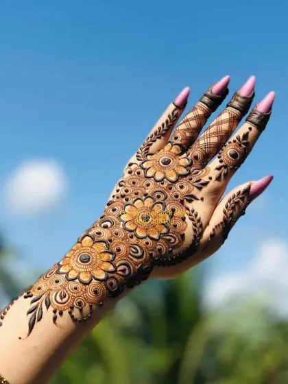 A stunning shot of a floral Arabic design against a clear blue sky. This style is perfect for outdoor events and photographs beautifully.